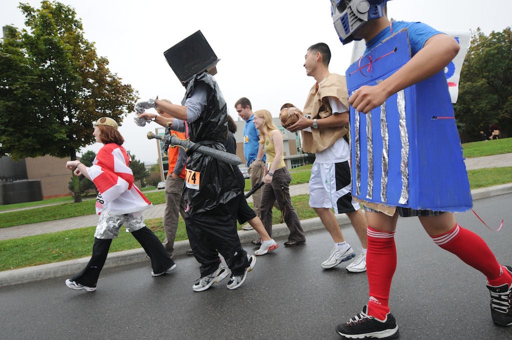 People running in various costumes