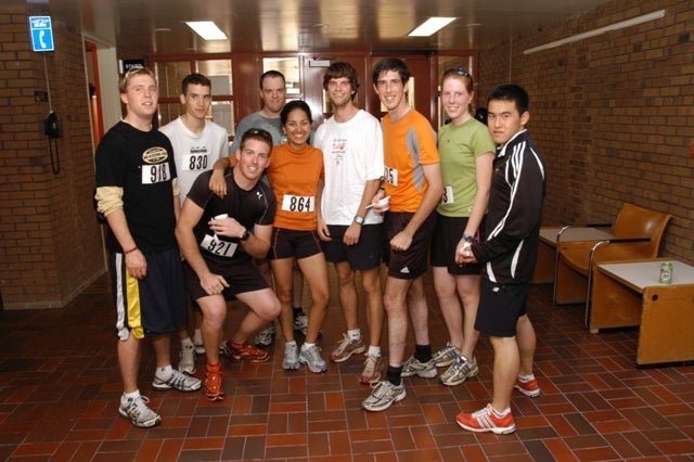 Nine runners of Fun Run posing together