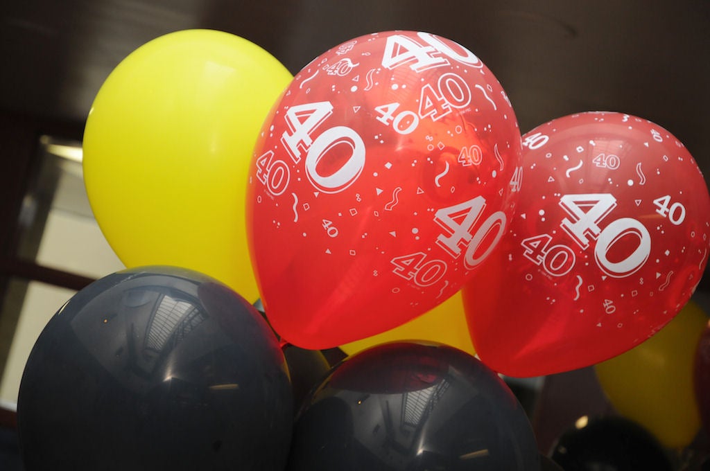 Black, yellow and red balloons with number 40 written 