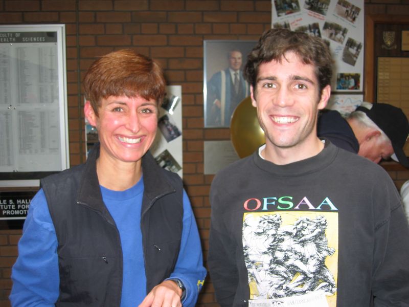 A man and woman smiling towards the camera