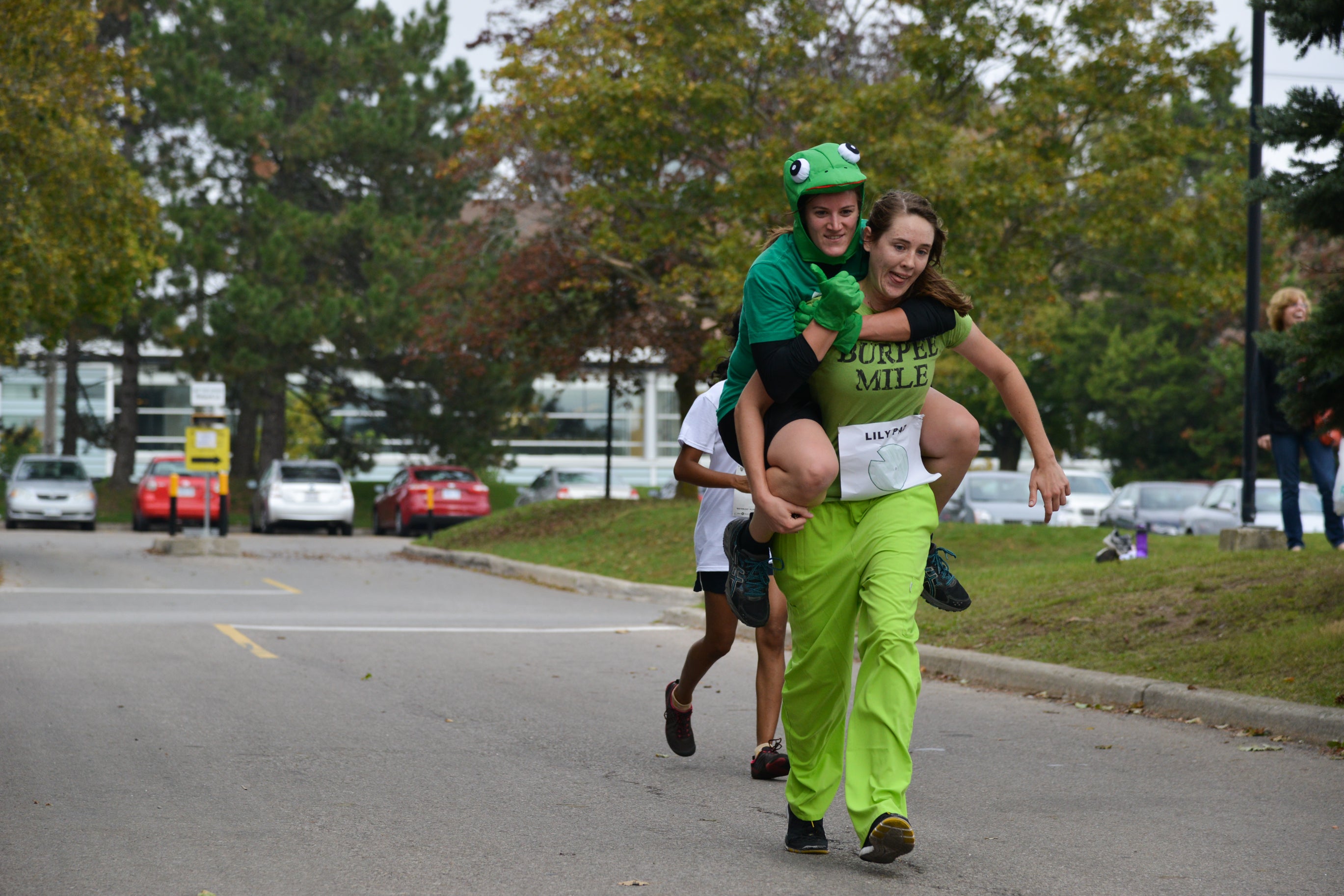 One student carrying another student on her back.