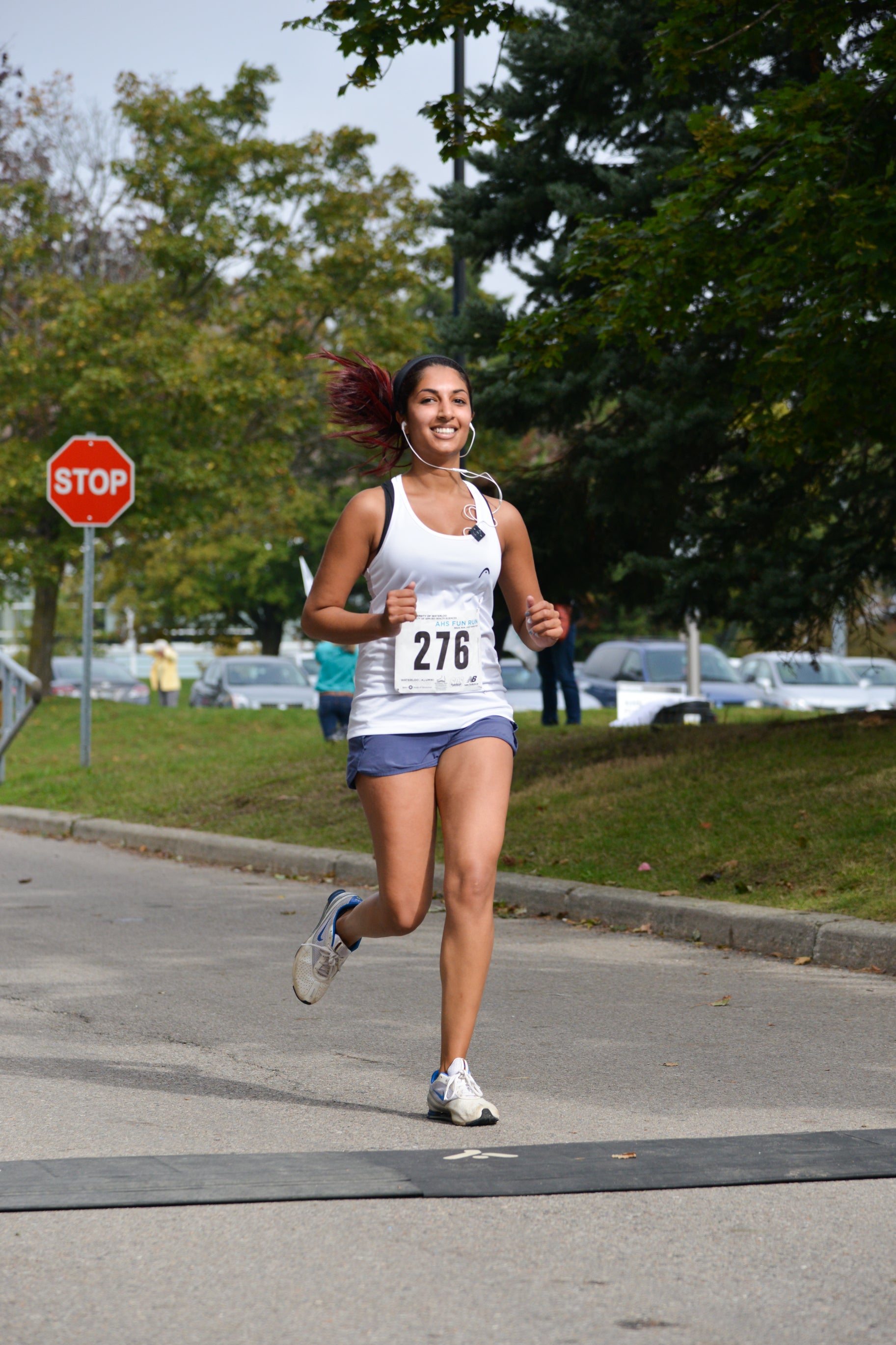 Student running and smiling.