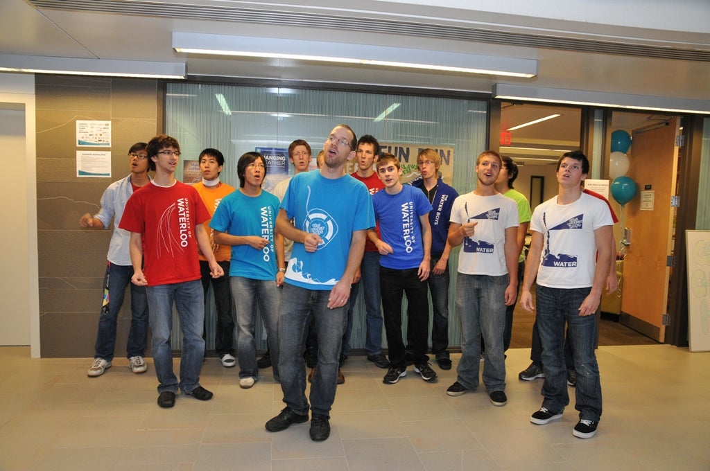 Guys in University of Waterloo shirt singing