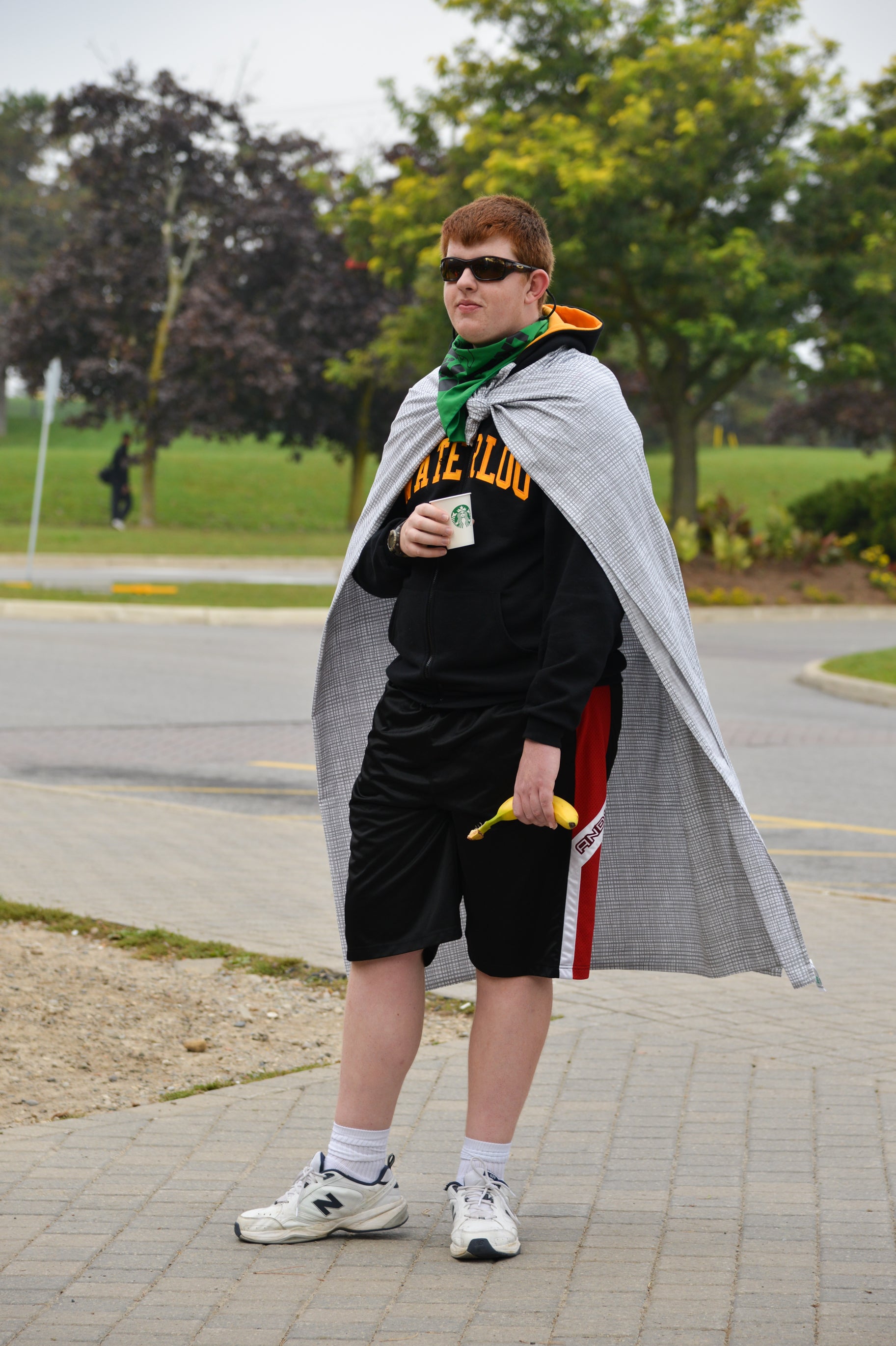 Student wearing Waterloo sweater and cape.