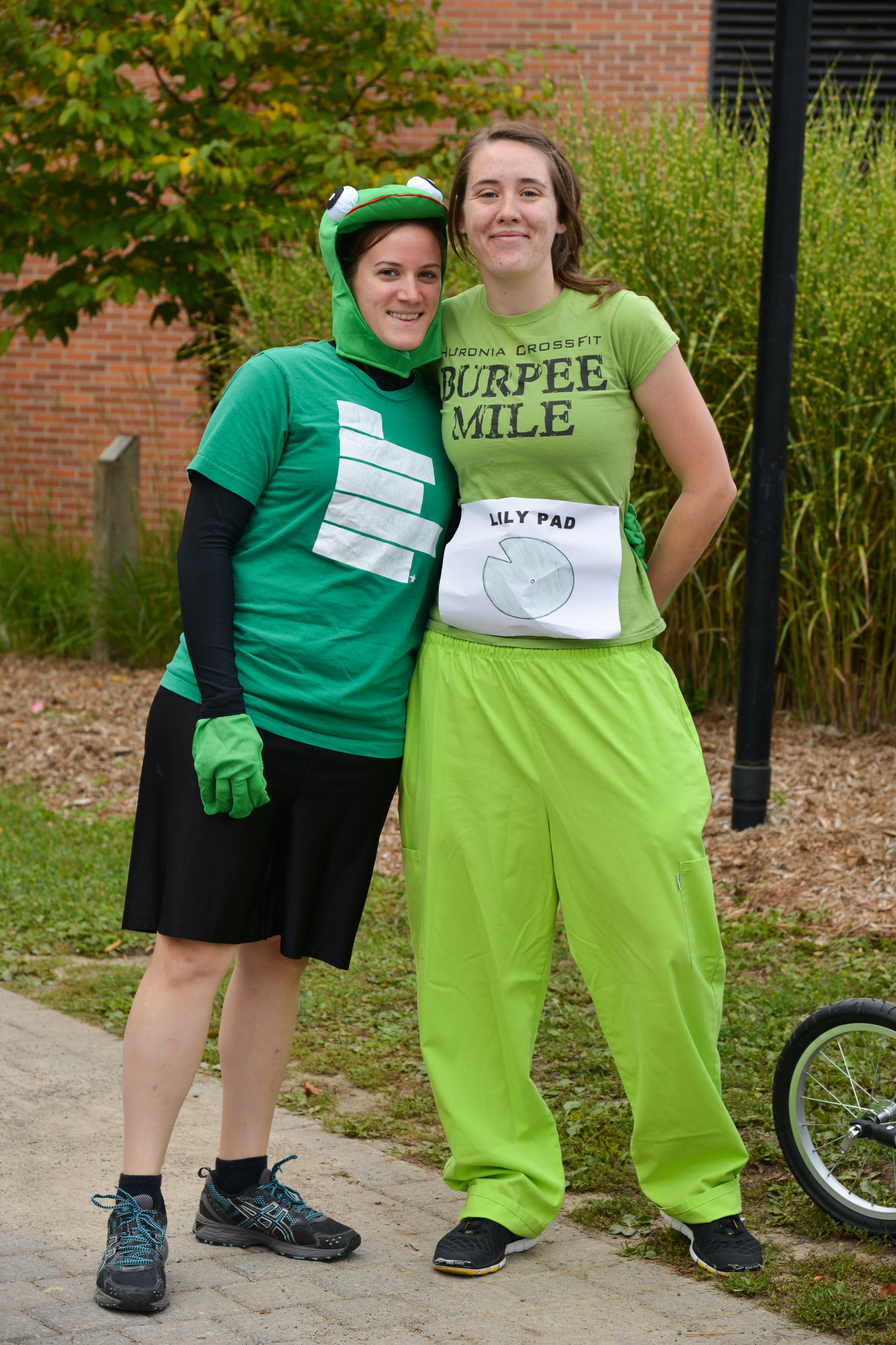 Two students wearing all green.