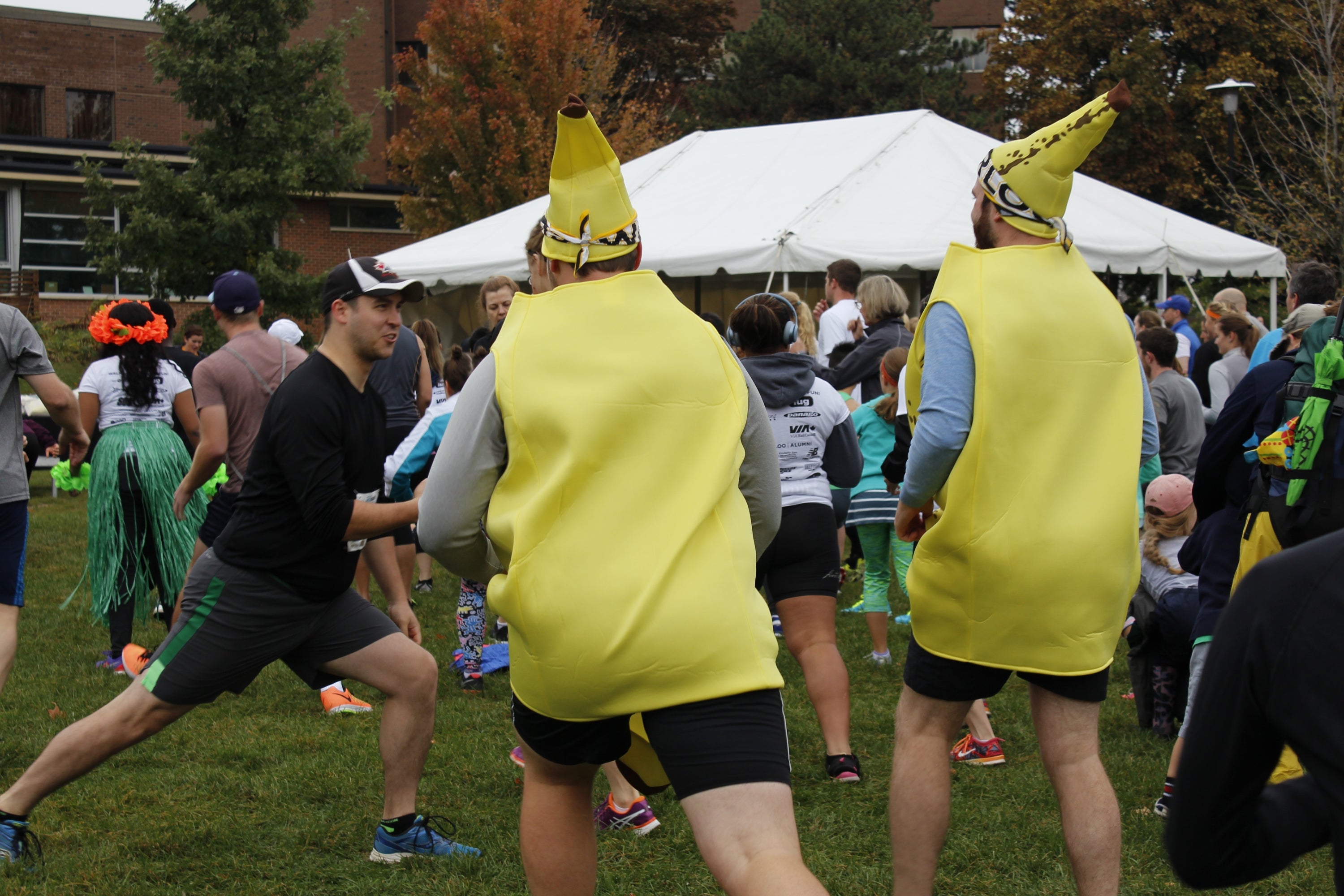 Two racers dressed up in a banana costume 