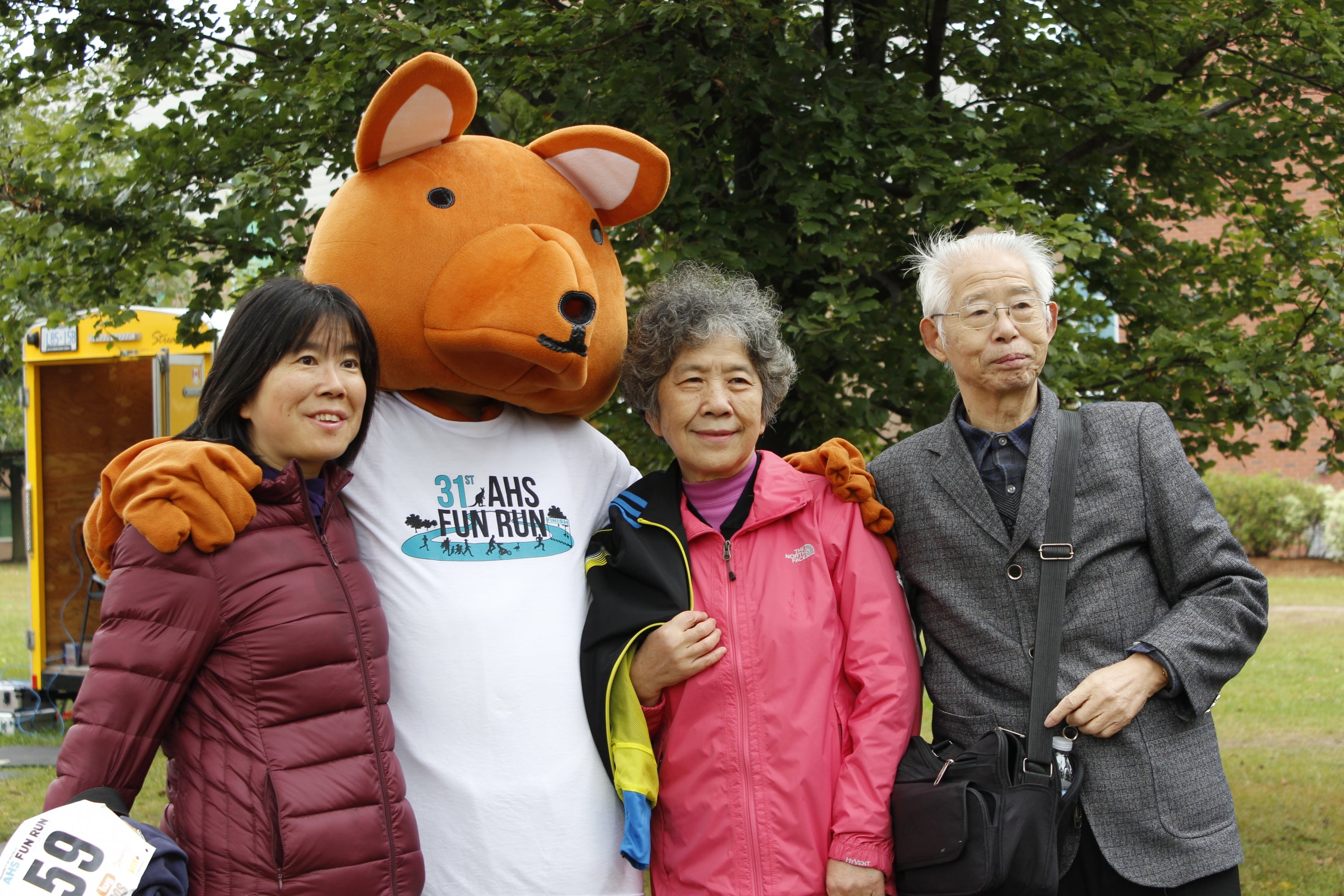 A family standing with AHSSIE the mascot
