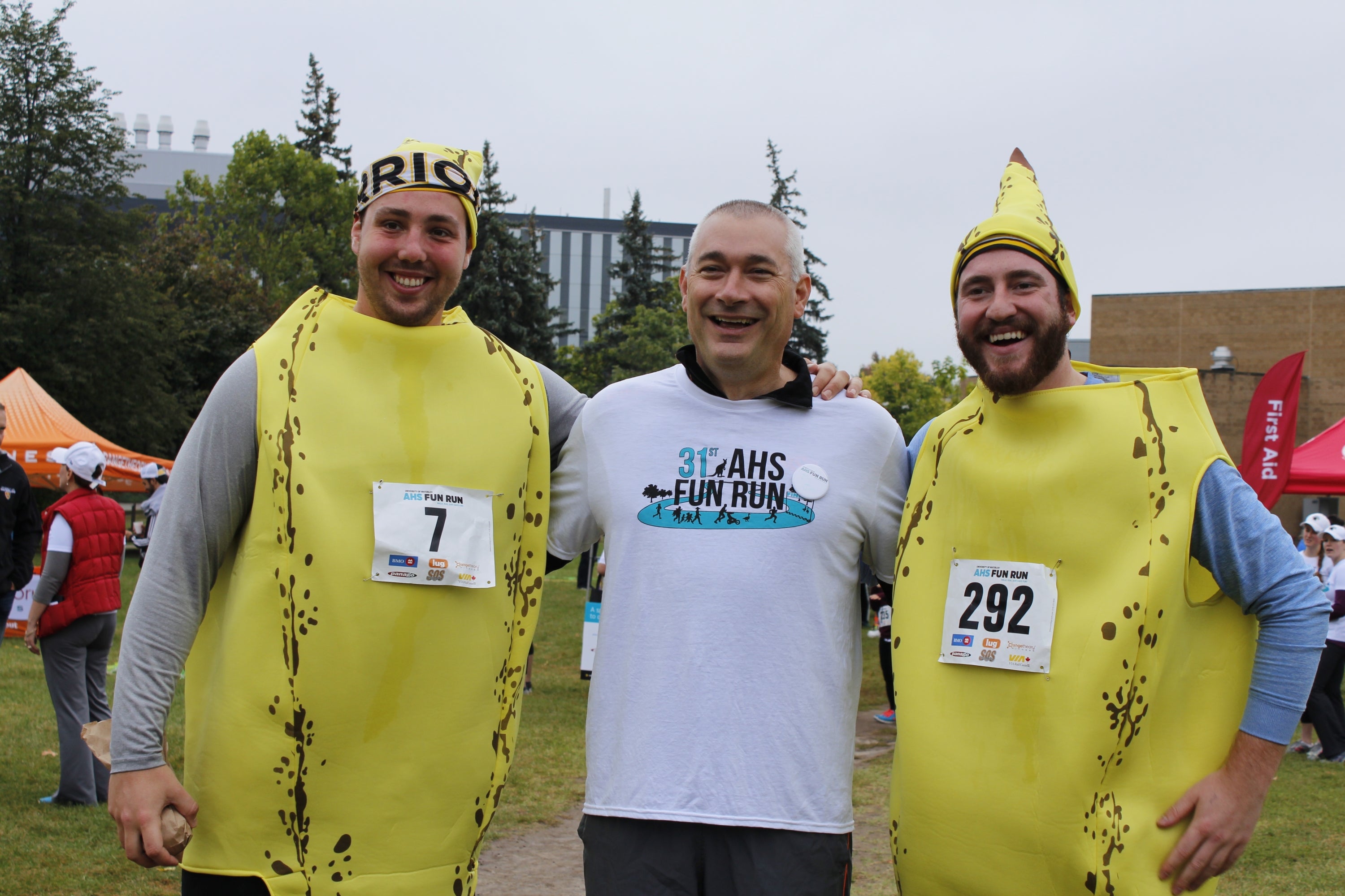 Dean of AHS with two runners dressed in costumes 