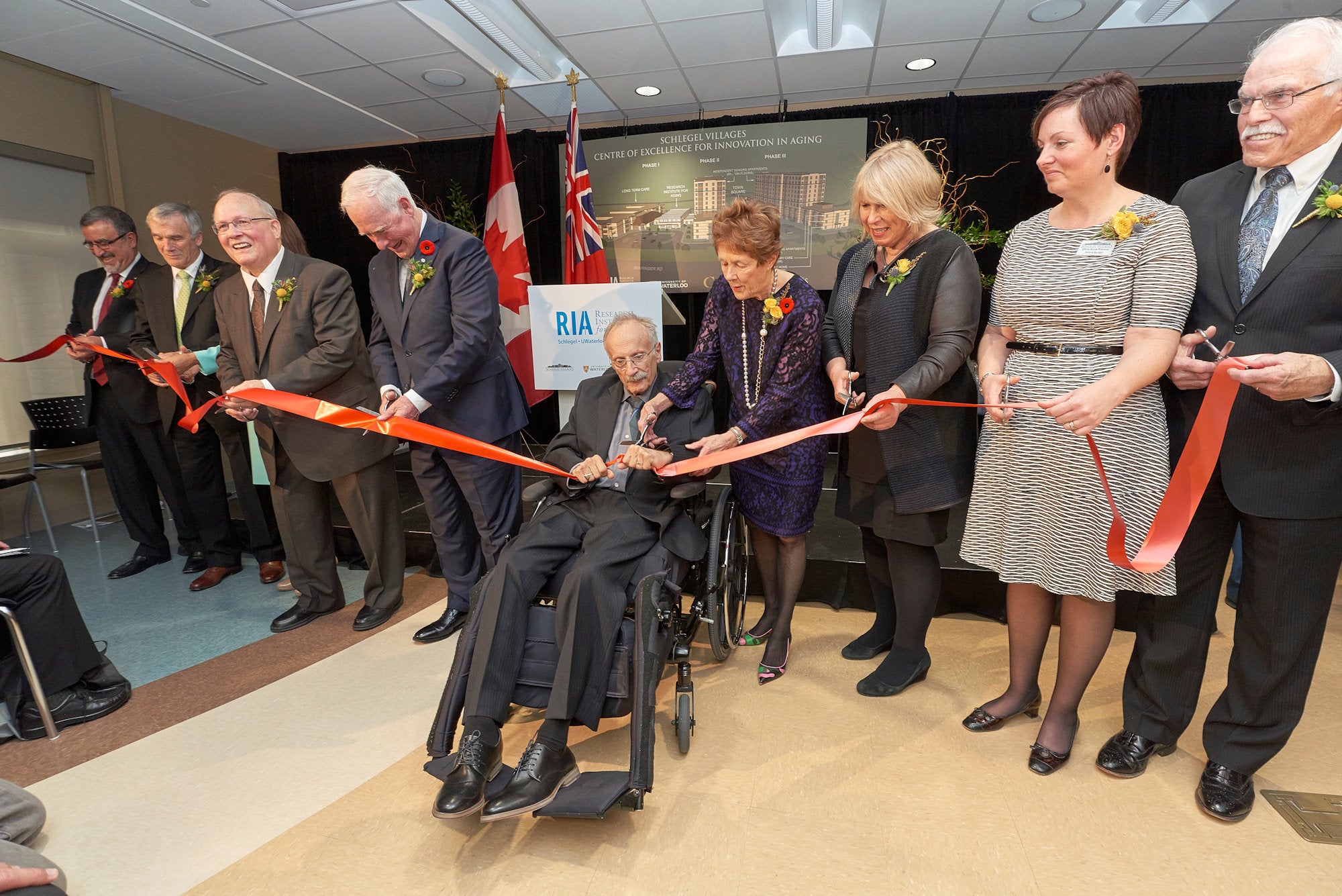 Dignitaries cut the ribbon at the grand opening of the Centre of Excellence for Innovation in Aging.