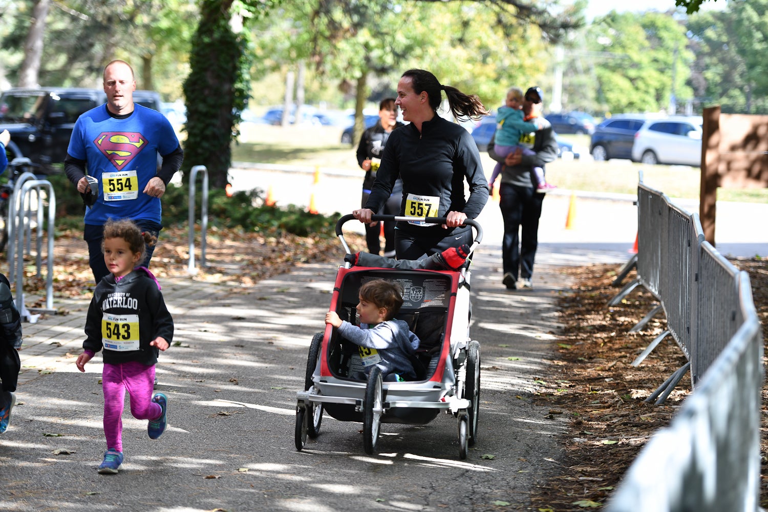 Family with stroller running