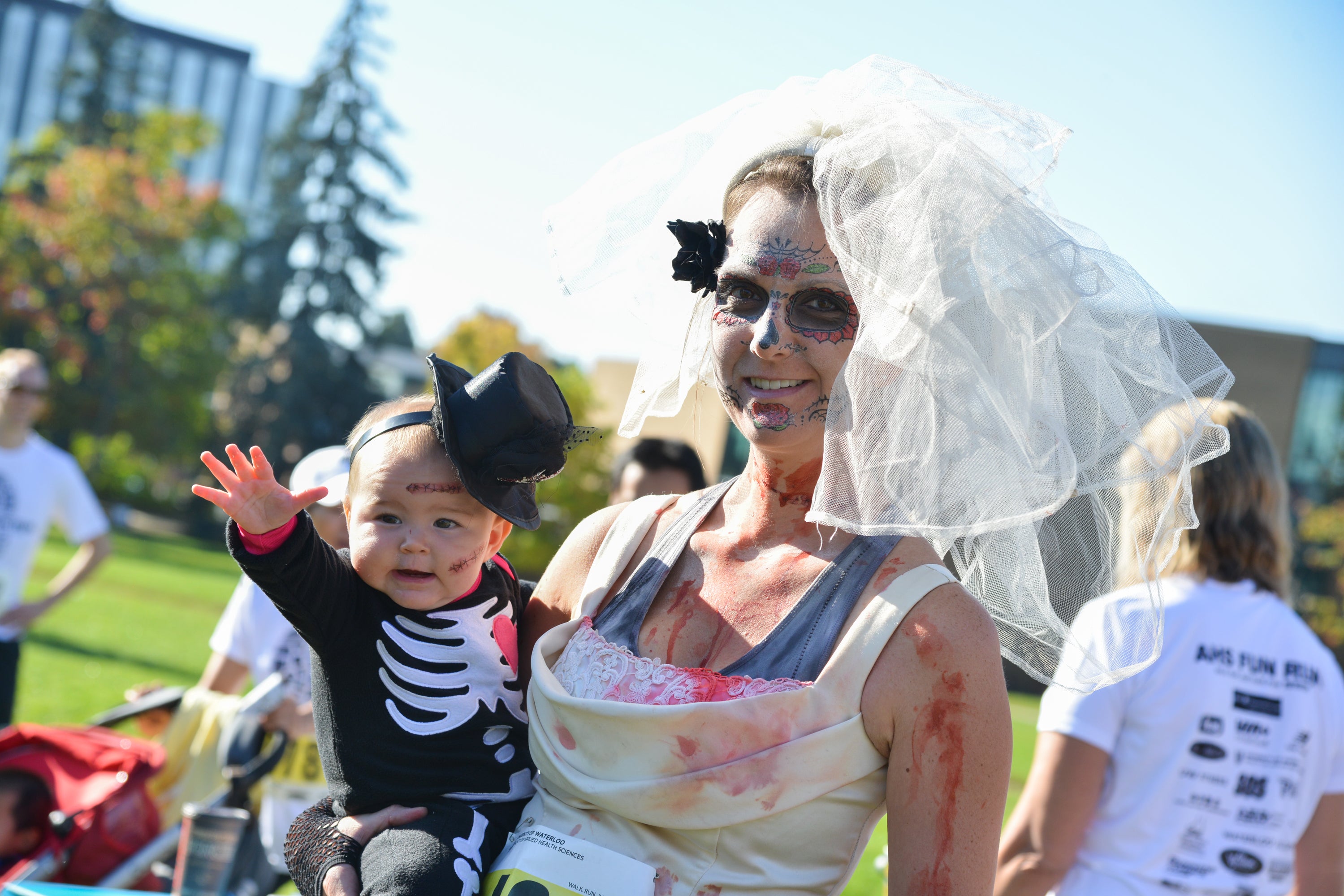 Fun Run participants and baby in costume