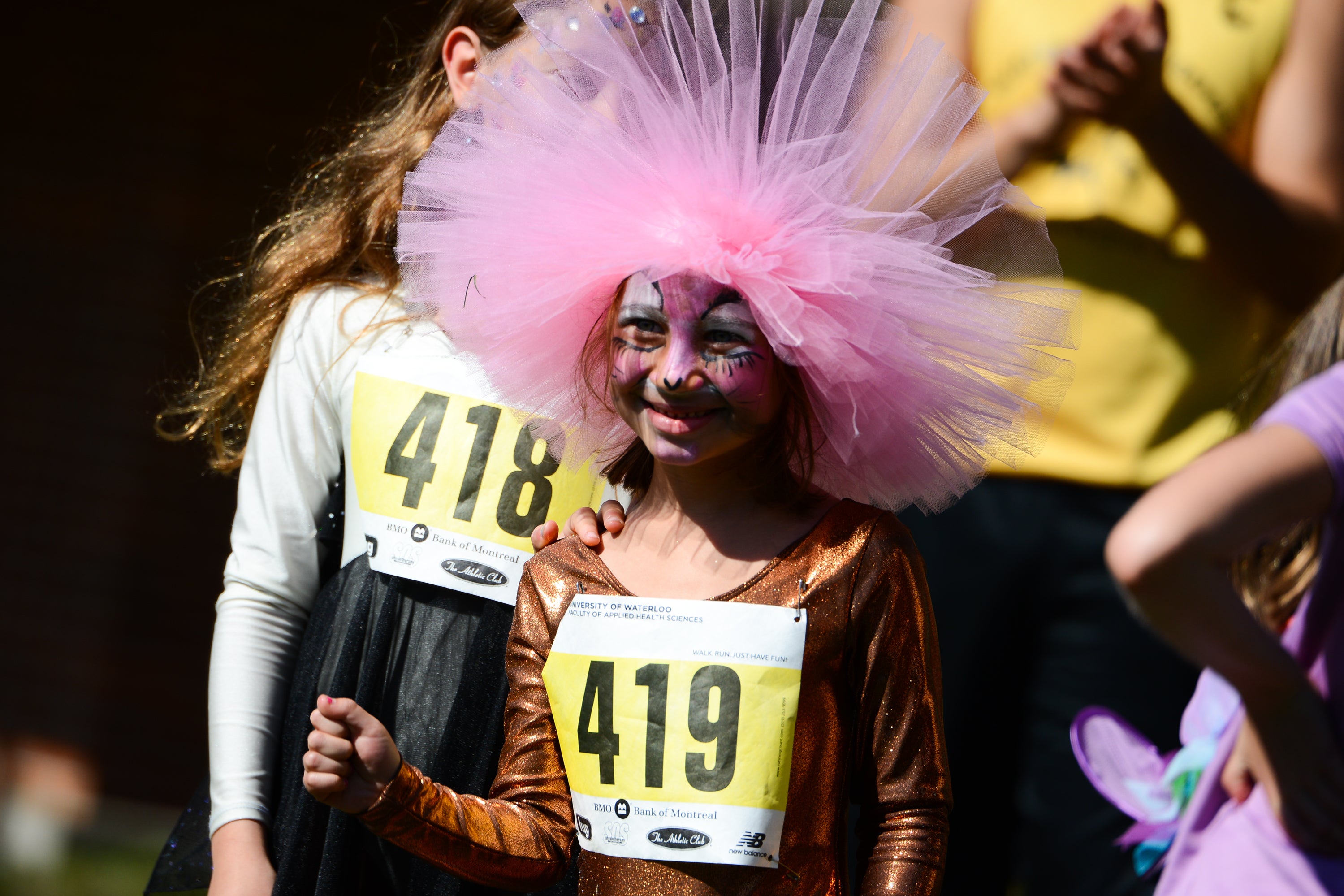 Child participant in costume after run