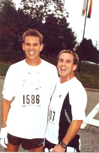 Two male runners staring at the camera smiling