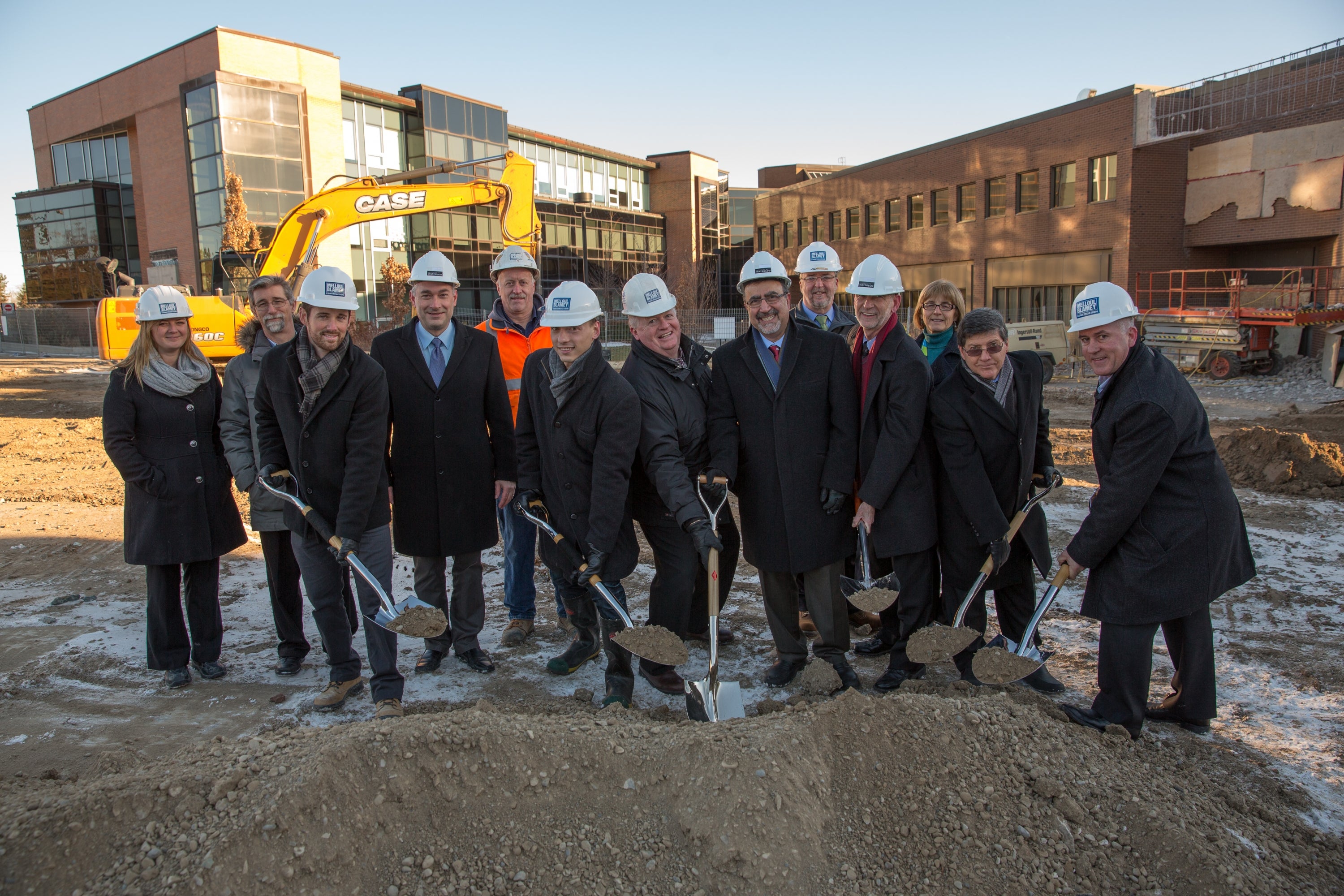 Employees of Melloul-Blamey Construction breaking ground alongside UWaterloo Administration and staff members.