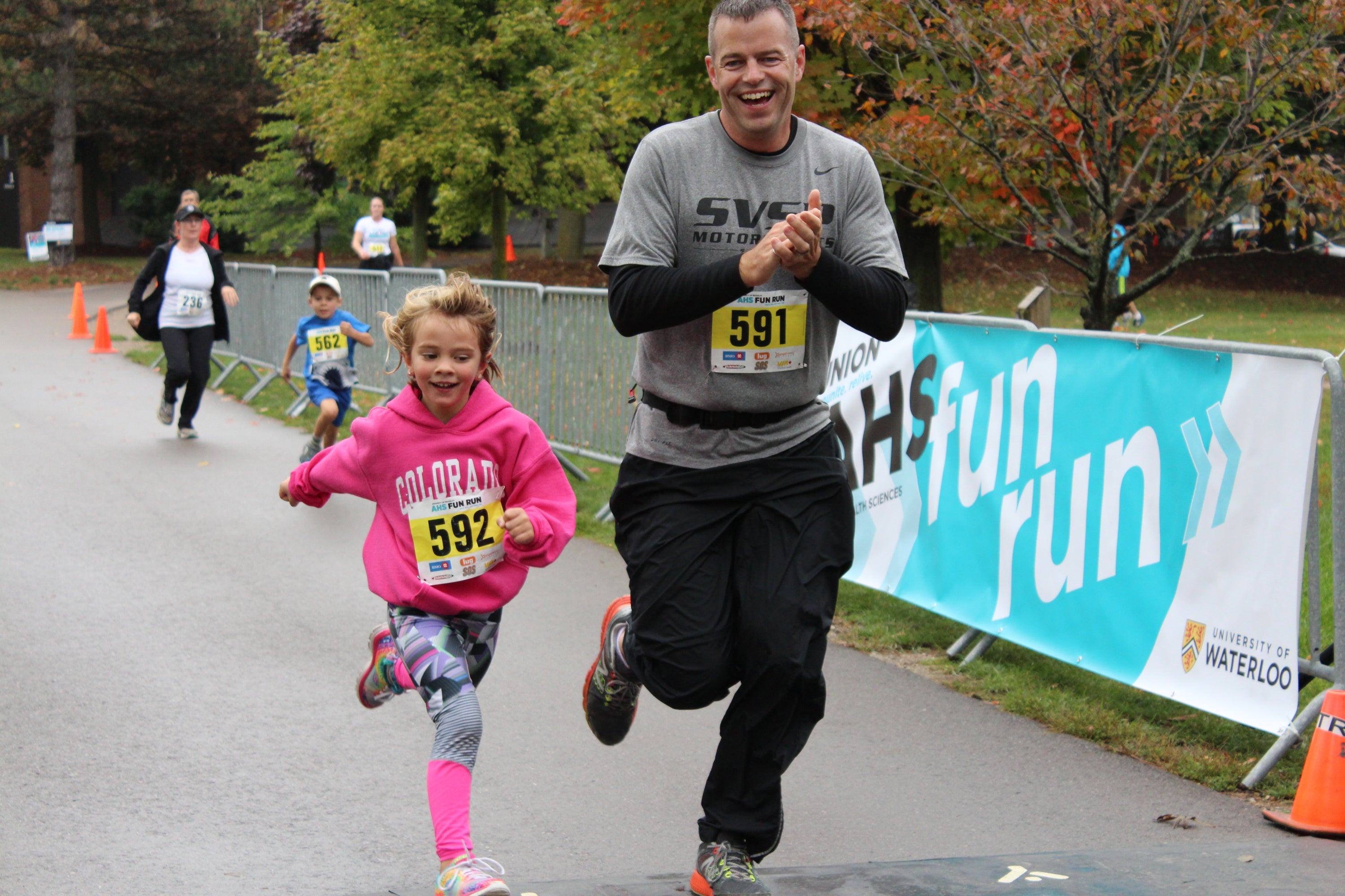 Father and daughter crossing the finish line 