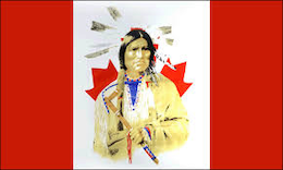 Indigenous person in front of Canadian flag.