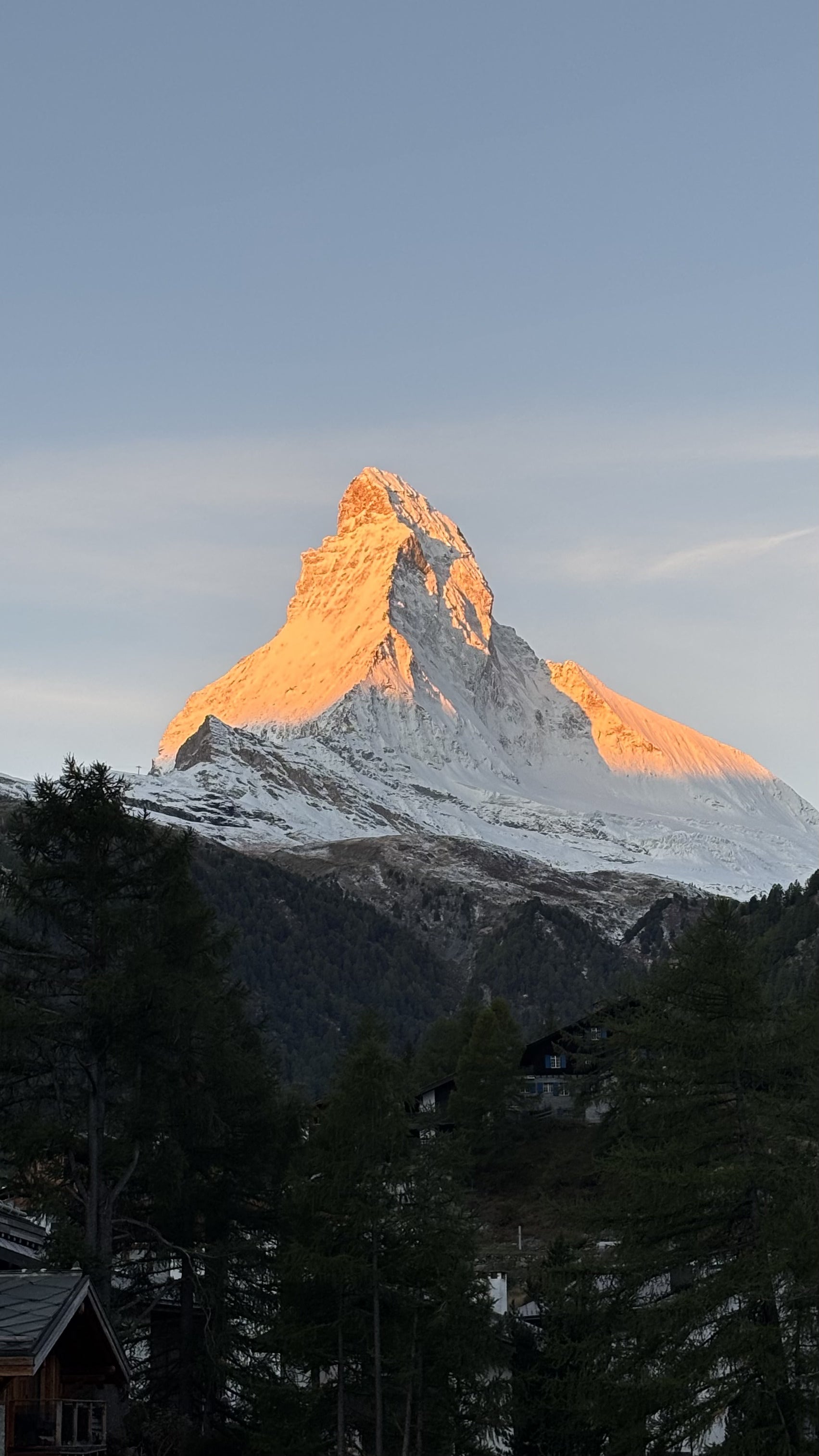 A breathtaking sunrise view from our hostel window before an early morning hike.