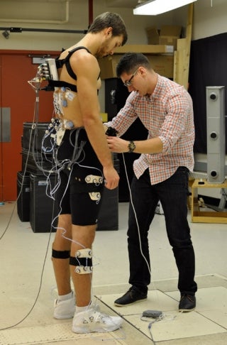 Jordan Cannon hookings up sensors to Jordan Kilganon in lab.