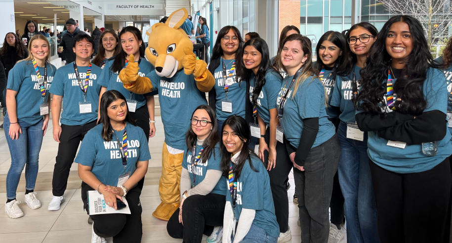 Group of Fall Open House volunteers with the AHSSIE mascott.