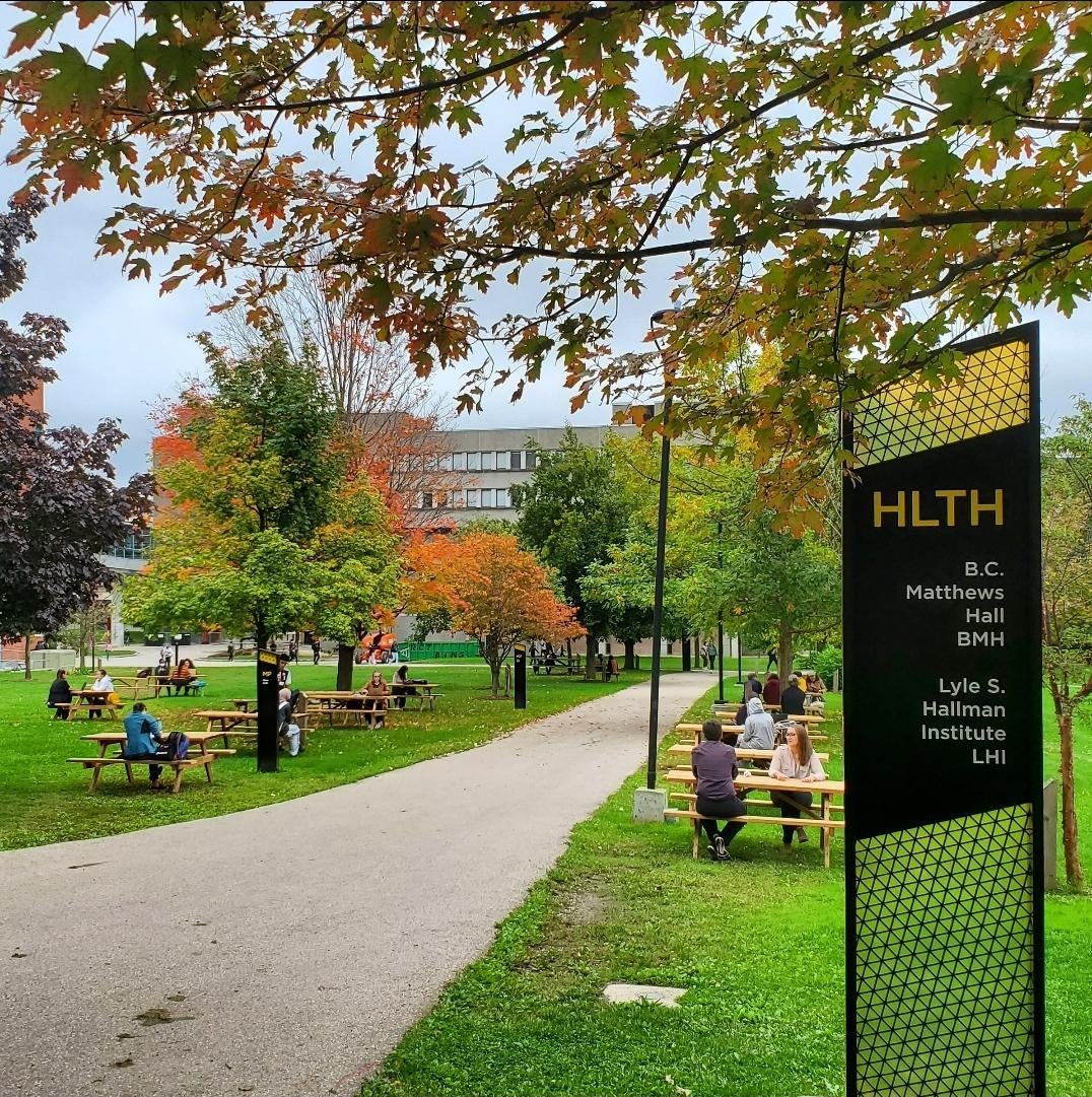 Path leading to BMH with picnic tables on either side