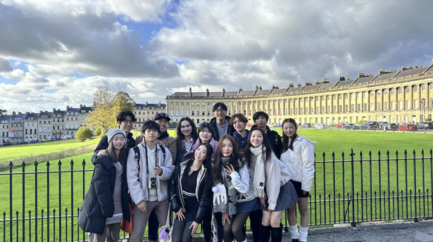 Beatrice and her friends standing for a picture in Bath, England.