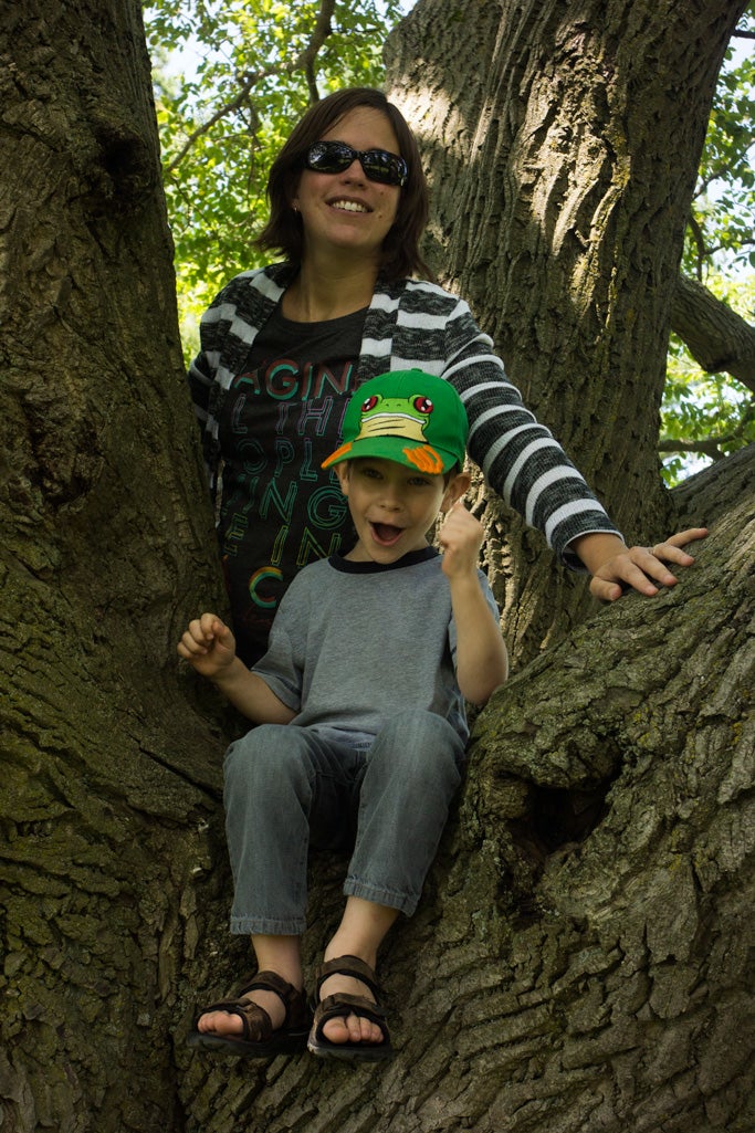 Cathy McAllister and her son in a tree