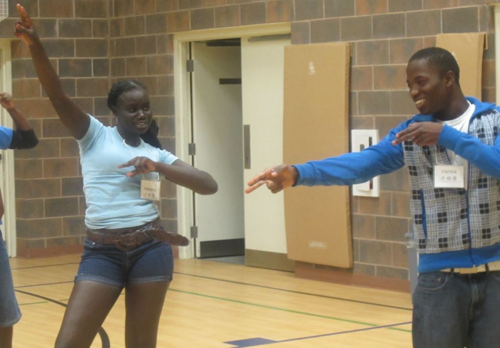 Two participants engaged in a drama activity