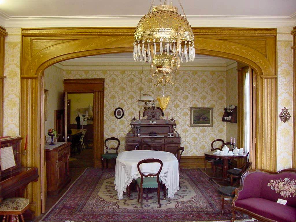 The interior of the Proctor House Museum: a historic dining room with antique furniture