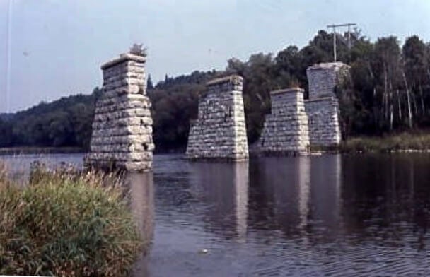 A different view of the ruined bridge which acted as a railway viaduct in a river near Paris, Ontario 