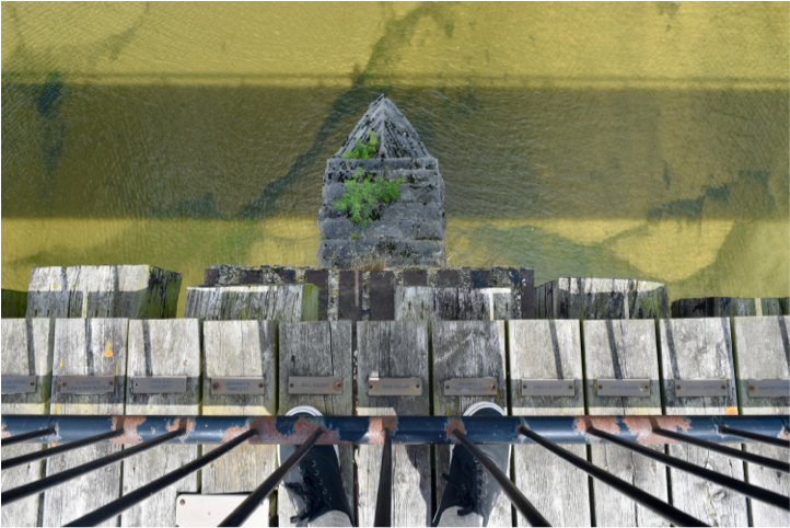 An image of the view off a bridge down into the water below