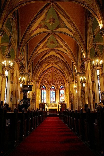 The inside of a church looking at the altar.