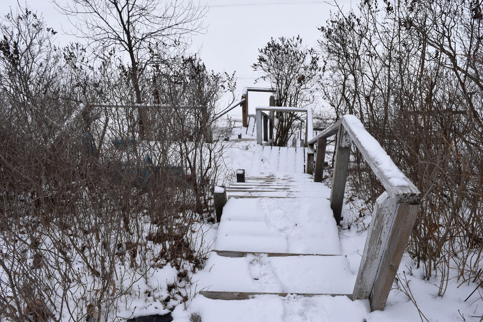 A steep stairway down the bluff to the water's edge in the winter time