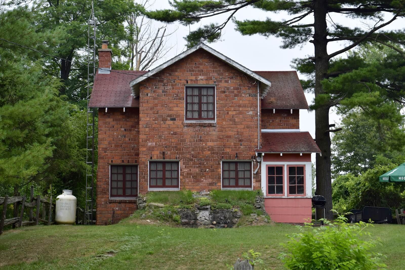 An image of a rare cottage building made of red brick at Rondeau