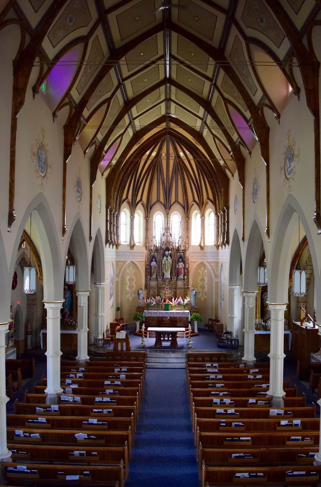 The inside of the Roman Catholic church looking at the altar.