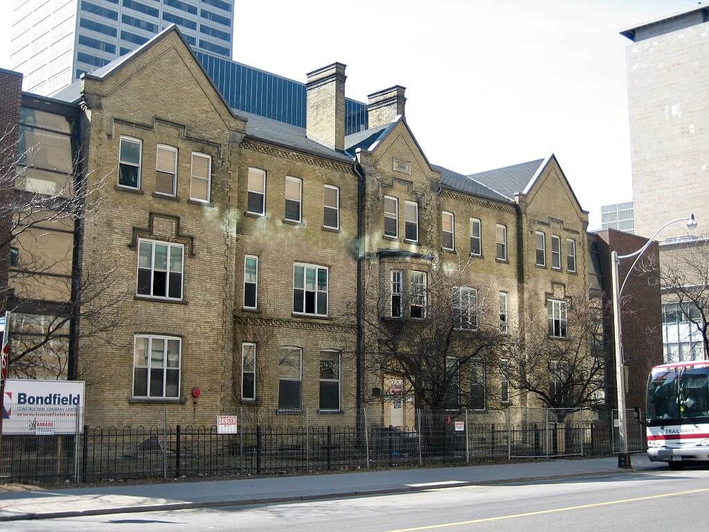 A mid-rise apartment frontage on Elm Street in Toronto