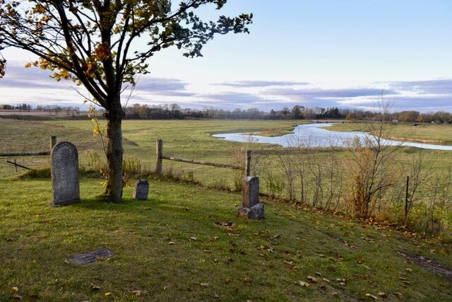 A photo of a cemetary overlooking a field