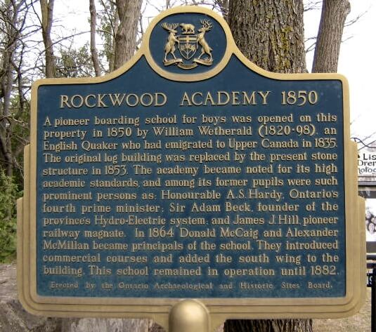 A plaque outside the ROckwood Academy explaining the history of the site