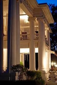 A side view of the entranceway columned portico at the Stratford White House