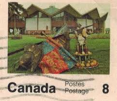 A pink Canadian postage stamp with an image of harvest decorations