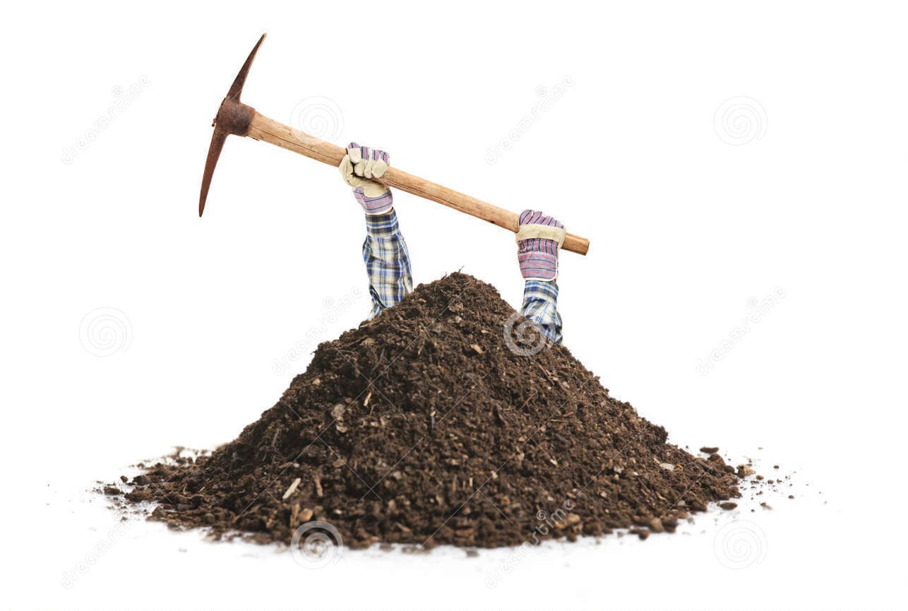 An image of male manual worker hands coming out of a pile of dirt holding a pickaxe