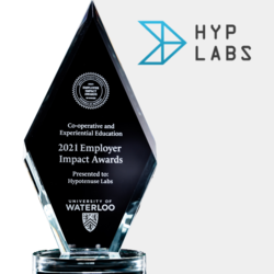 Diamond shaped glass trophy with Hypotenuse labs logo beside it