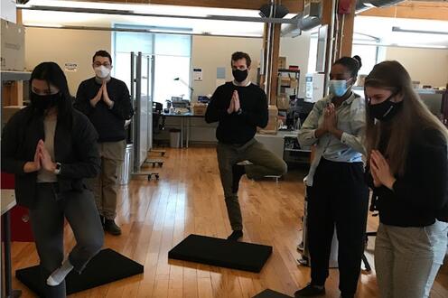 CleanSlate UV team members practicing yoga