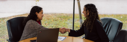 Employer and student shaking hands