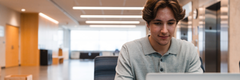 Male student working on laptop