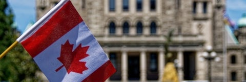 Building with the Canadian flag in front of it