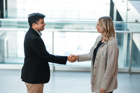 employer shaking student's hand