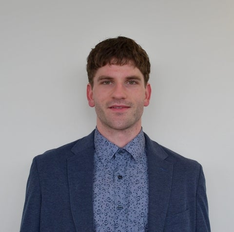 man standing in front of wall