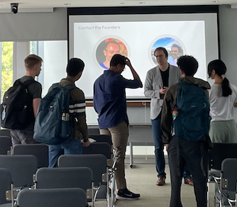 Students chatting with Leap Tools founder at information session