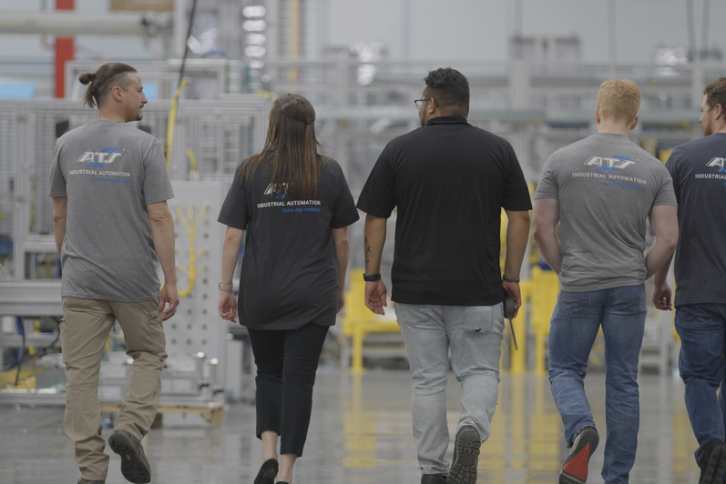 ATS people walking in the plant