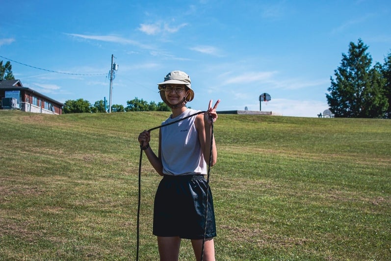 University of Waterloo co-op student Leila Levi posing for photo at Camp Brebeuf